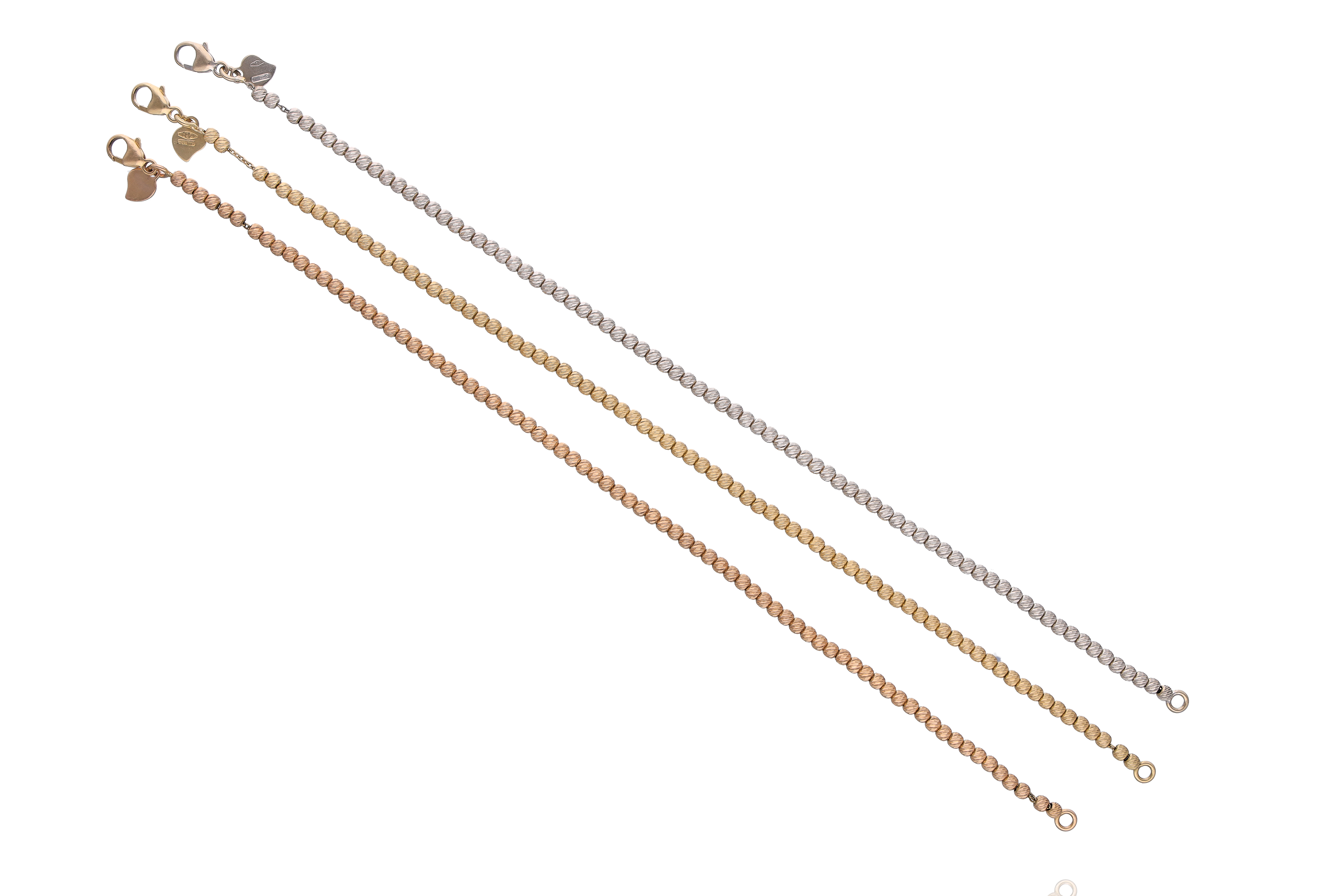 Tre bracciali in oro - Asta Preziosi