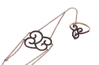 Baciamano con diamanti neri e pietre - Asta Preziosi