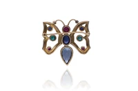 Spilla con zaffiri, rubini, smeraldi, diamanti e topazio - Asta Preziosi