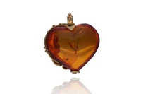 Ciondolo con ambra trattata - Asta Preziosi