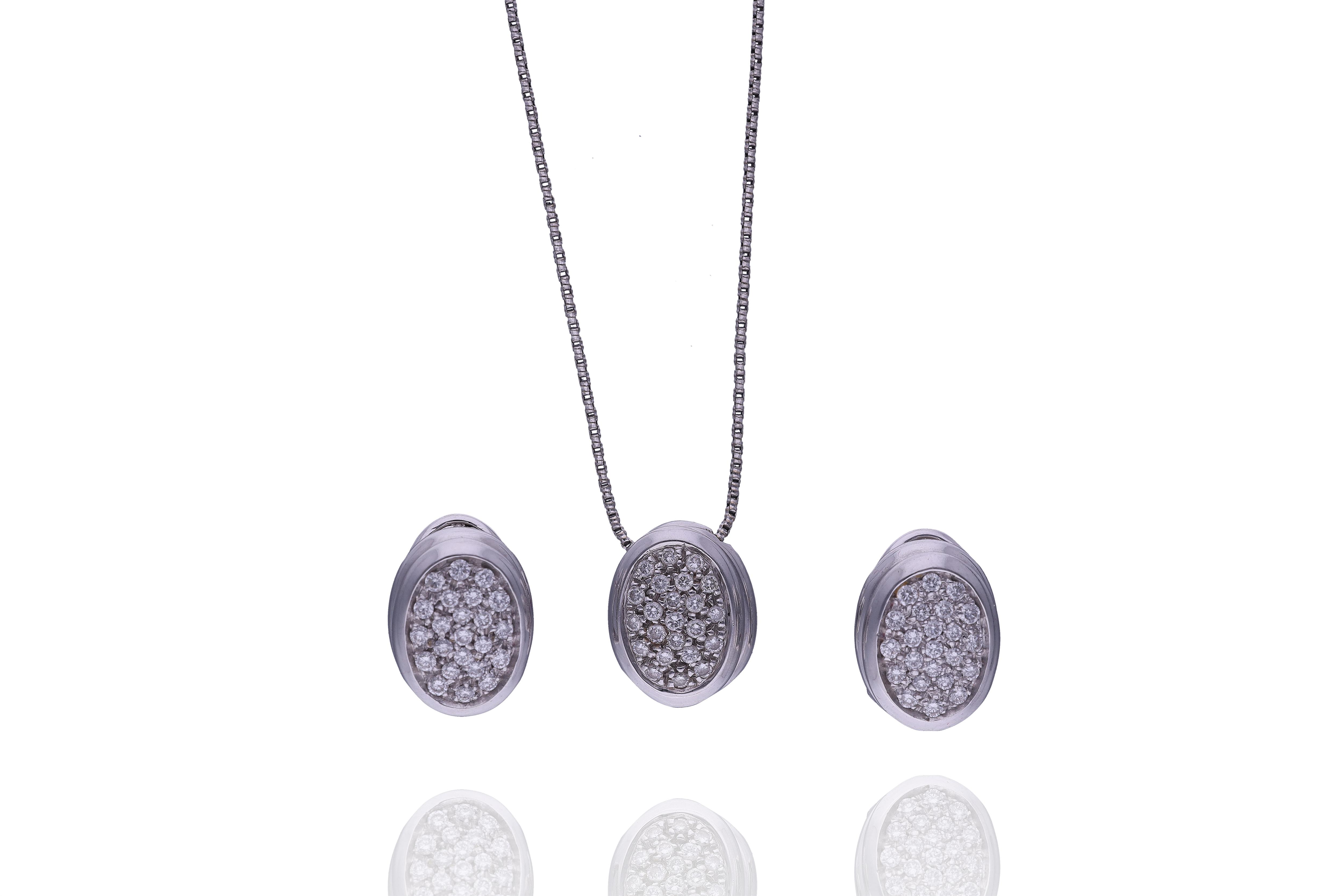 Damiani, collana con pendente e orecchini - Asta Preziosi