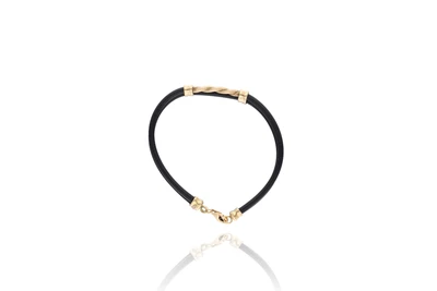 Bracciale semirigido, realizzato in caucciÃ?Â¹ e oro giallo 750 - Asta Preziosi