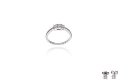Parure composta da anello e orecchini con diamanti - Asta Preziosi Parure composta da anello e orecchini con diamanti - Asta Preziosi