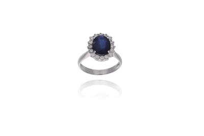 Anello con pietra centrale e diamanti - Asta Preziosi Anello con pietra centrale e diamanti - Asta Preziosi