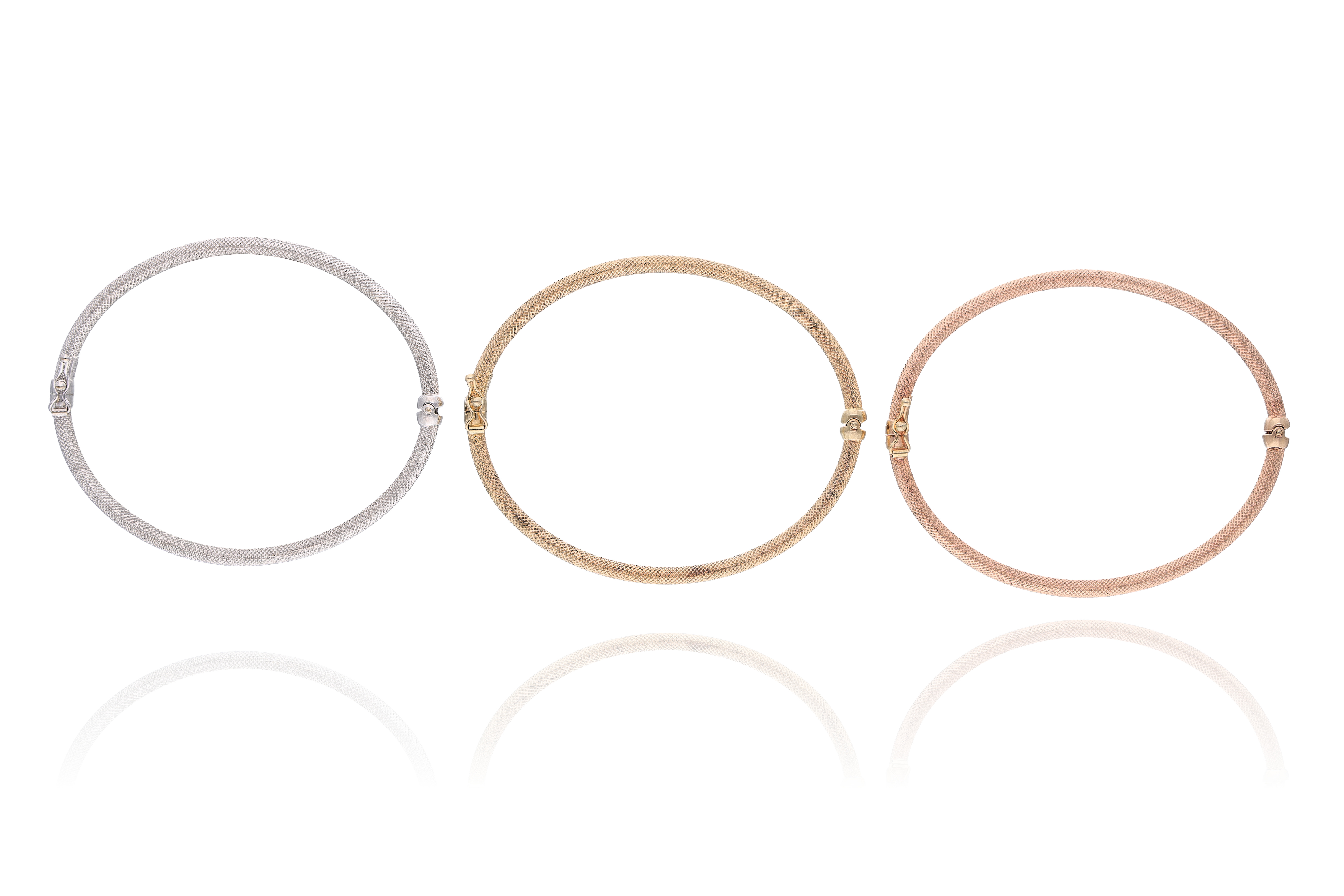 Tre bracciali in oro - Asta Preziosi