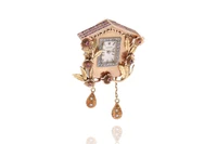Spilla con orologio con rubini, pietre e diamanti - Asta speciale orologi Spilla con orologio con rubini, pietre e diamanti - Asta speciale orologi