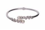 Bracciale rigido con pietre e perle - Asta Preziosi Bracciale rigido con pietre e perle - Asta Preziosi
