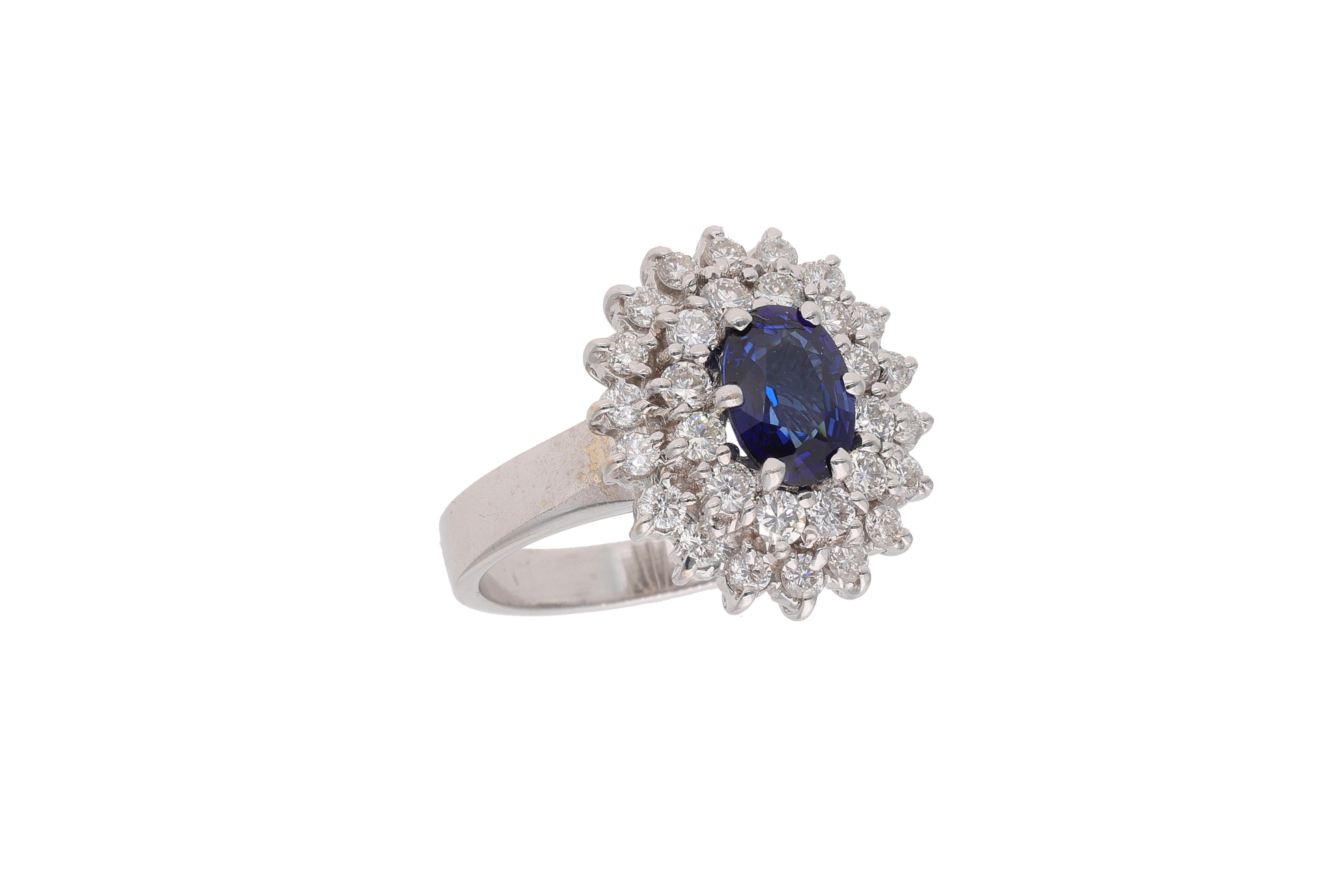 Anello con diamanti e pietra blu - Asta Preziosi