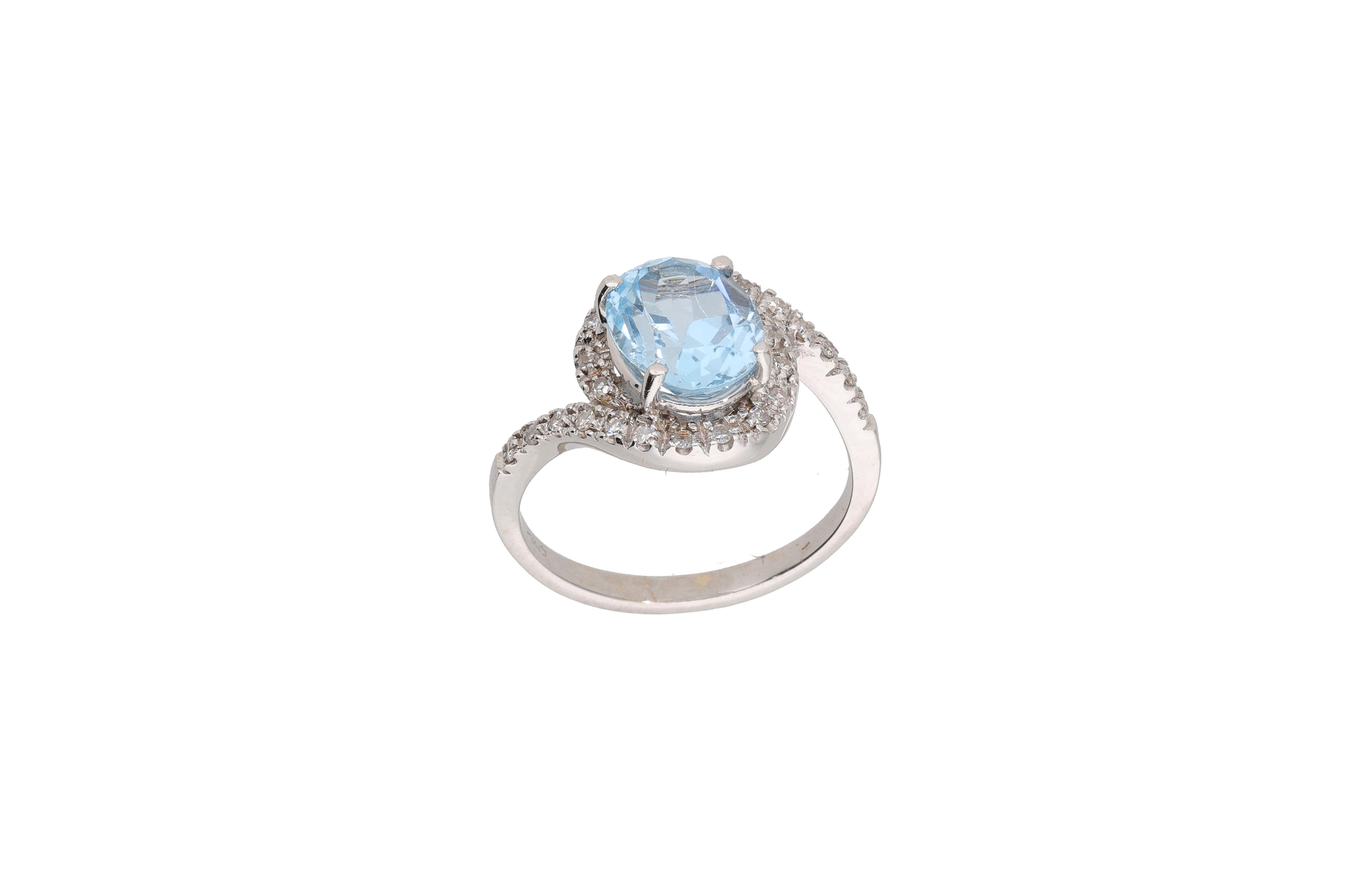 Anello con diamanti e topazio azzurro - Asta Preziosi