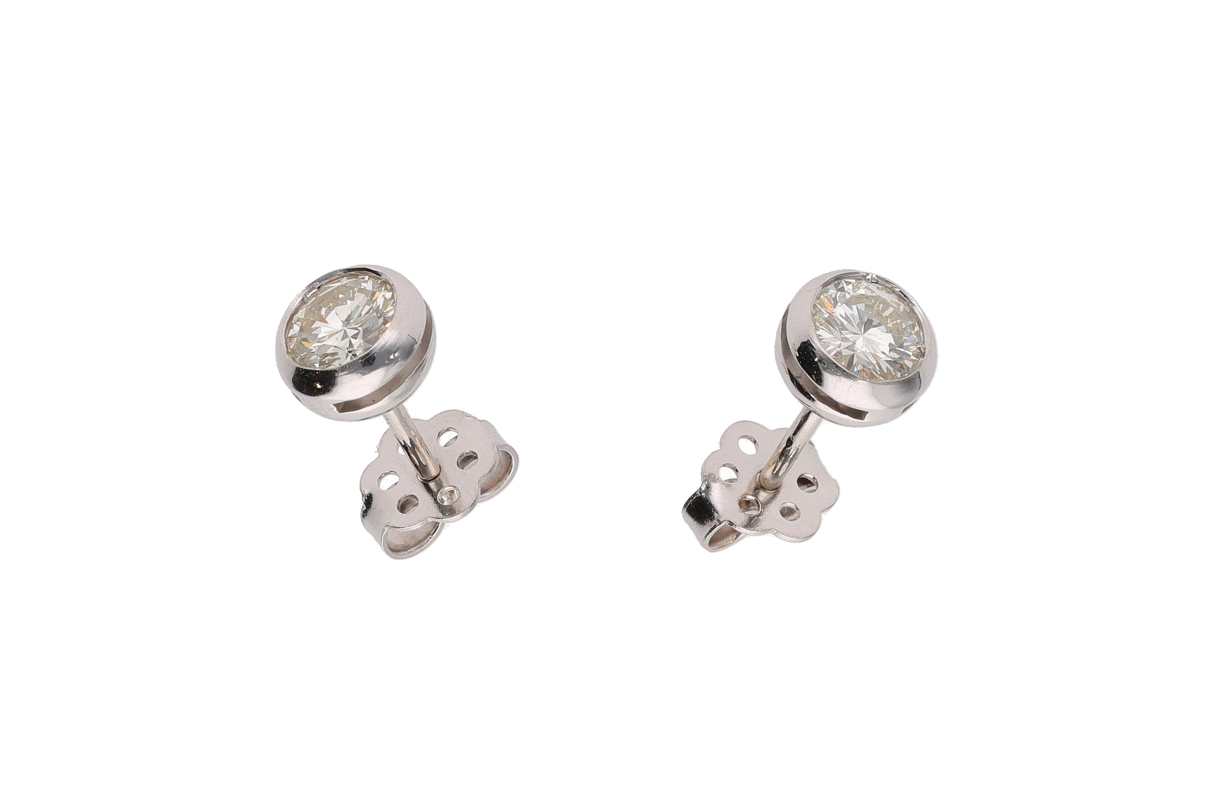 Coppia di orecchini punto luce con diamanti - Asta Preziosi