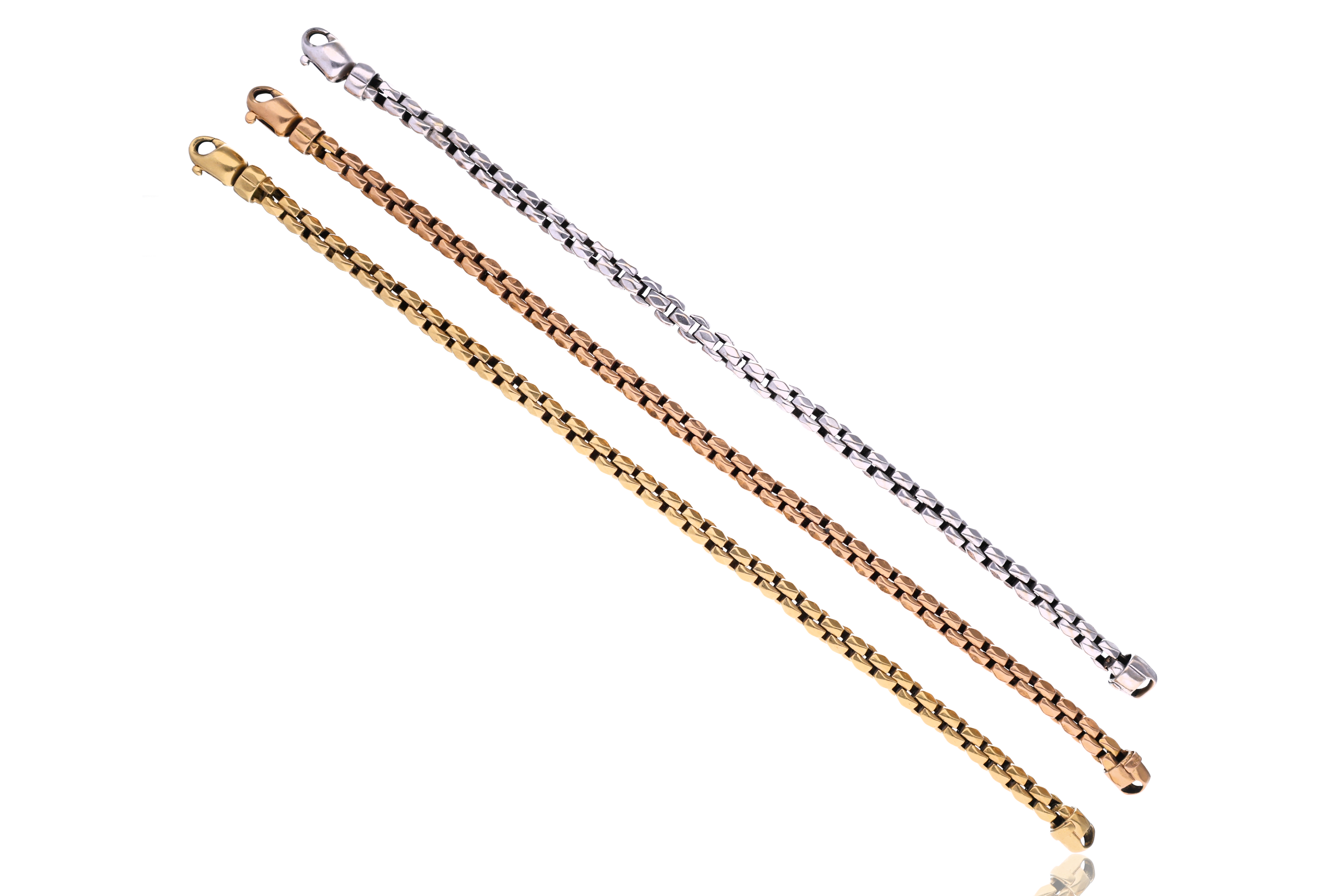Tre bracciali in oro - Asta Preziosi