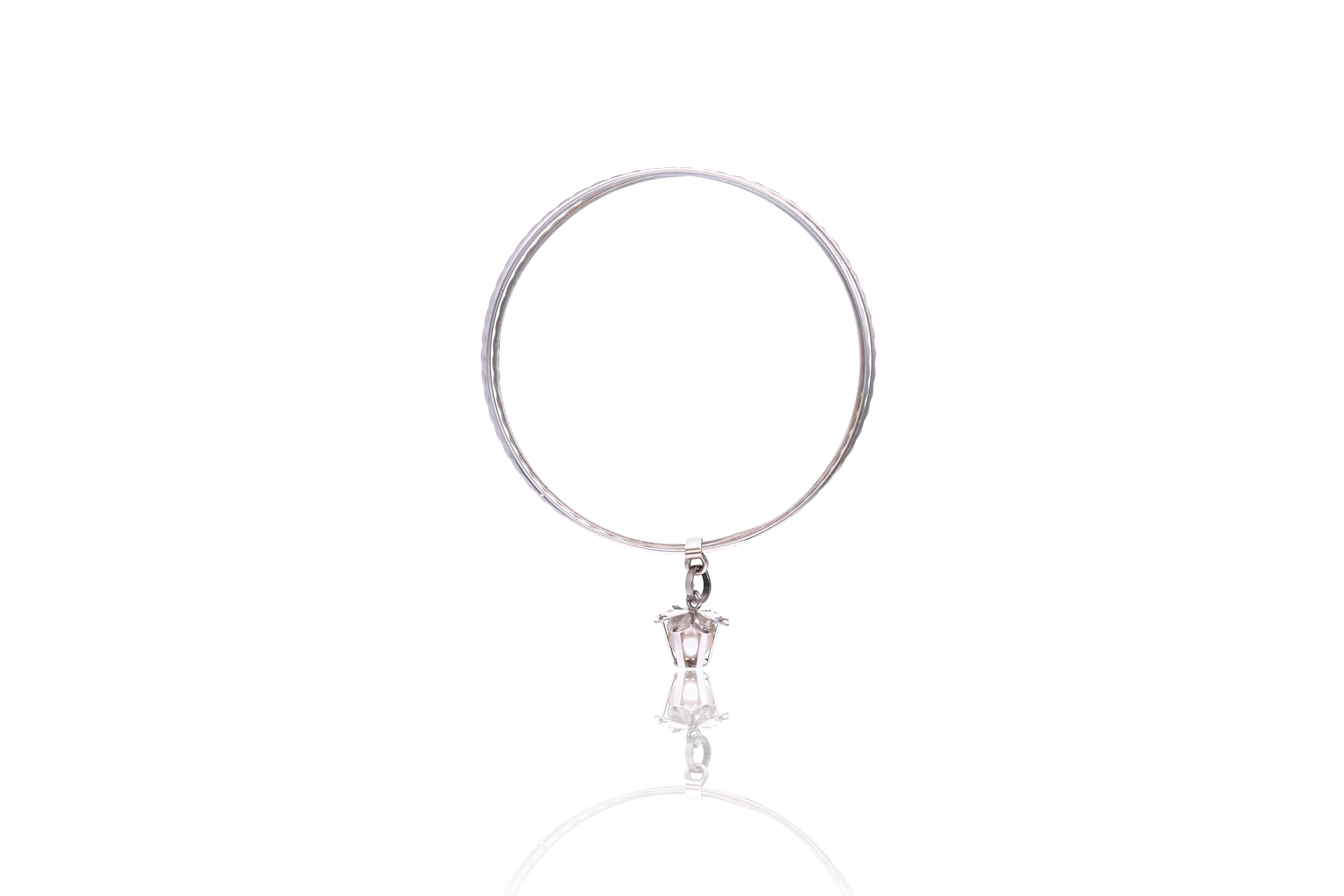 Bracciale con ciondolo in oro - Asta Preziosi