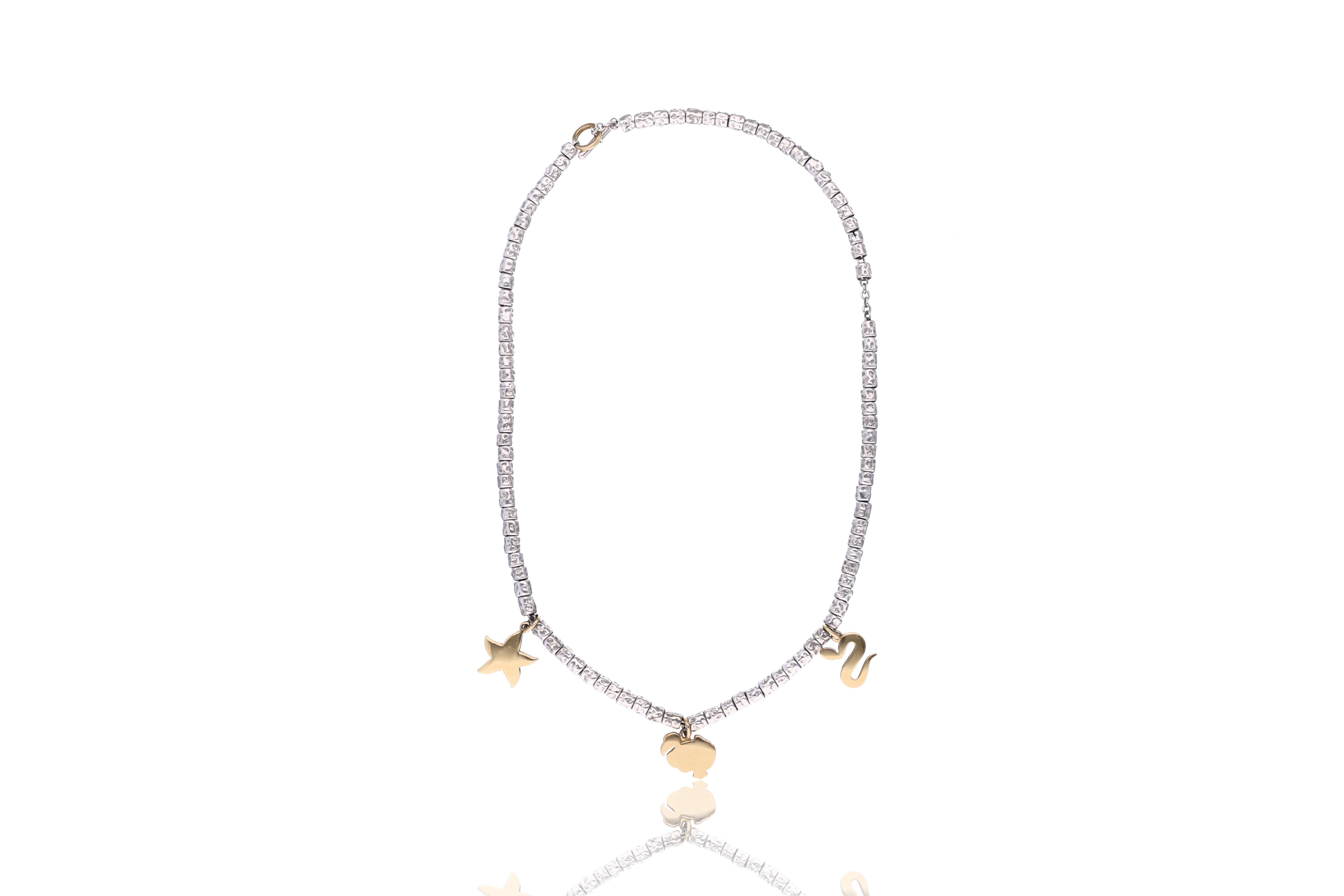 Pomellato, Dodo, tre ciondoli in oro con collana in argento - Asta Preziosi