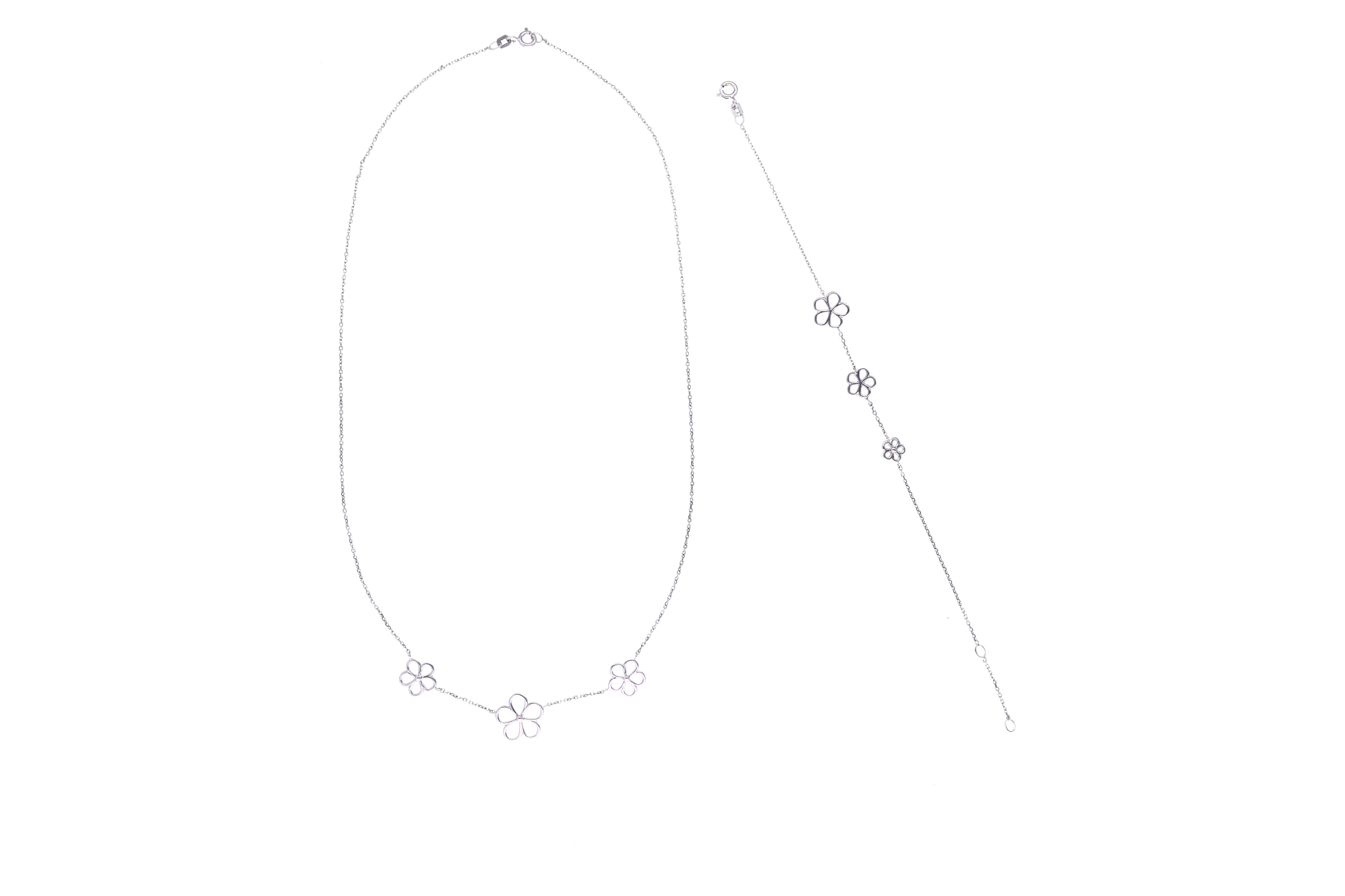 Demi-parure, collana e bracciale in oro bianco - Asta Preziosi