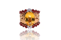 Anello con quarzo citrino, granati e diamanti - Asta Preziosi Anello con quarzo citrino, granati e diamanti - Asta Preziosi