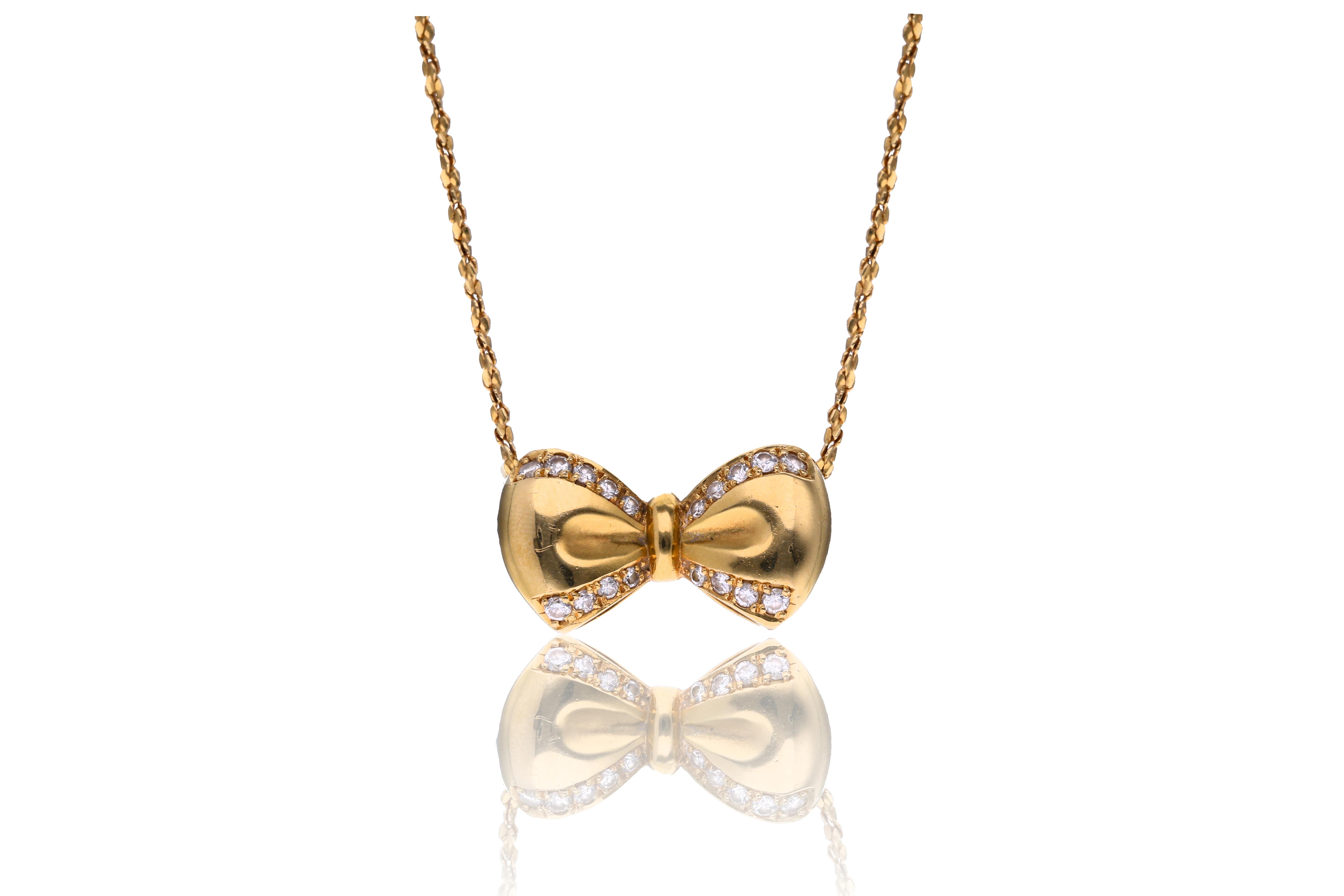 Collana e ciondolo a forma di fiocco con diamanti - Asta Preziosi