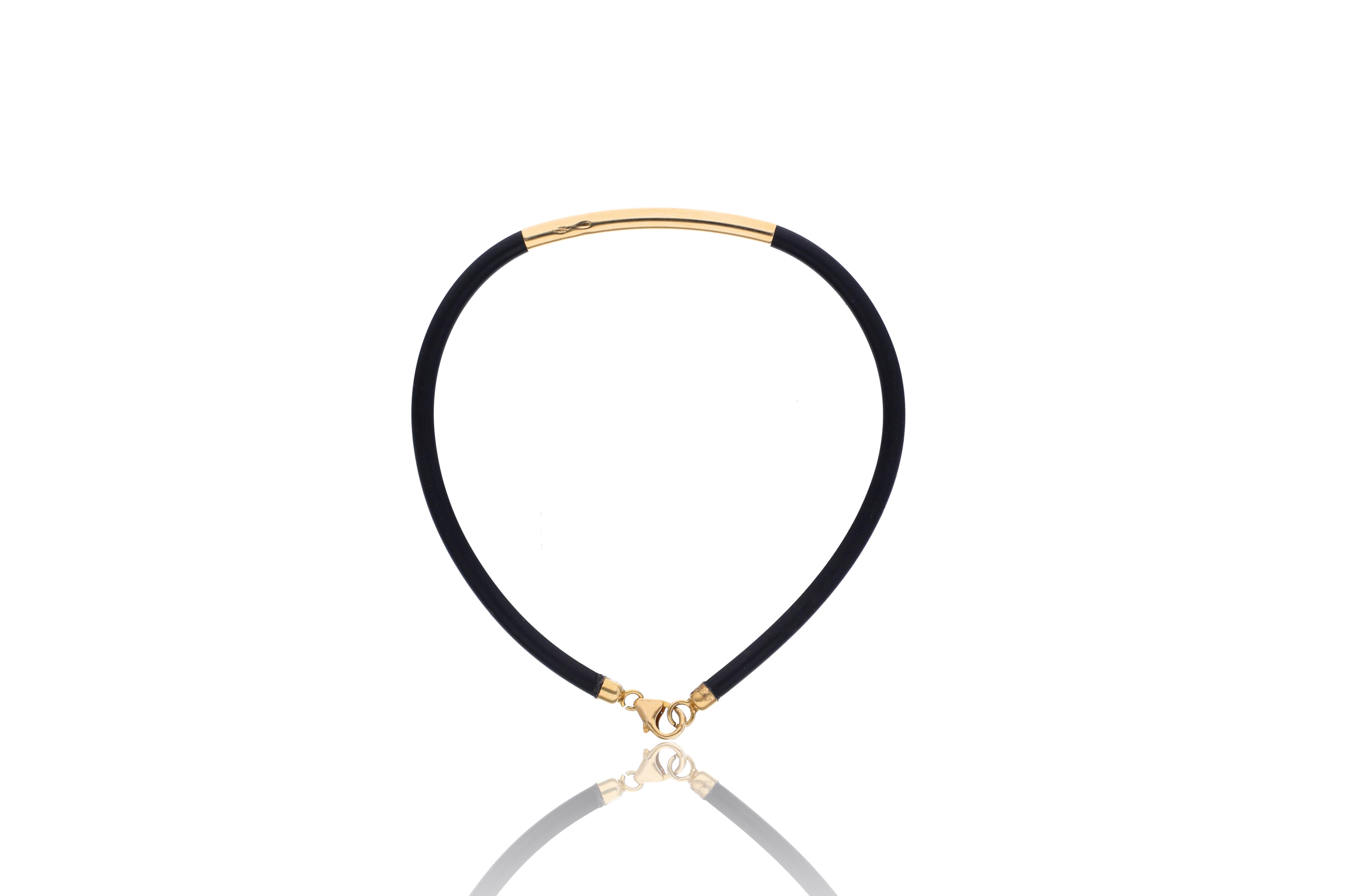Bracciale in caucciu' con elementi in oro - Asta Preziosi
