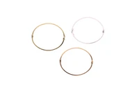 Tre bracciali rigidi in oro - Asta Preziosi