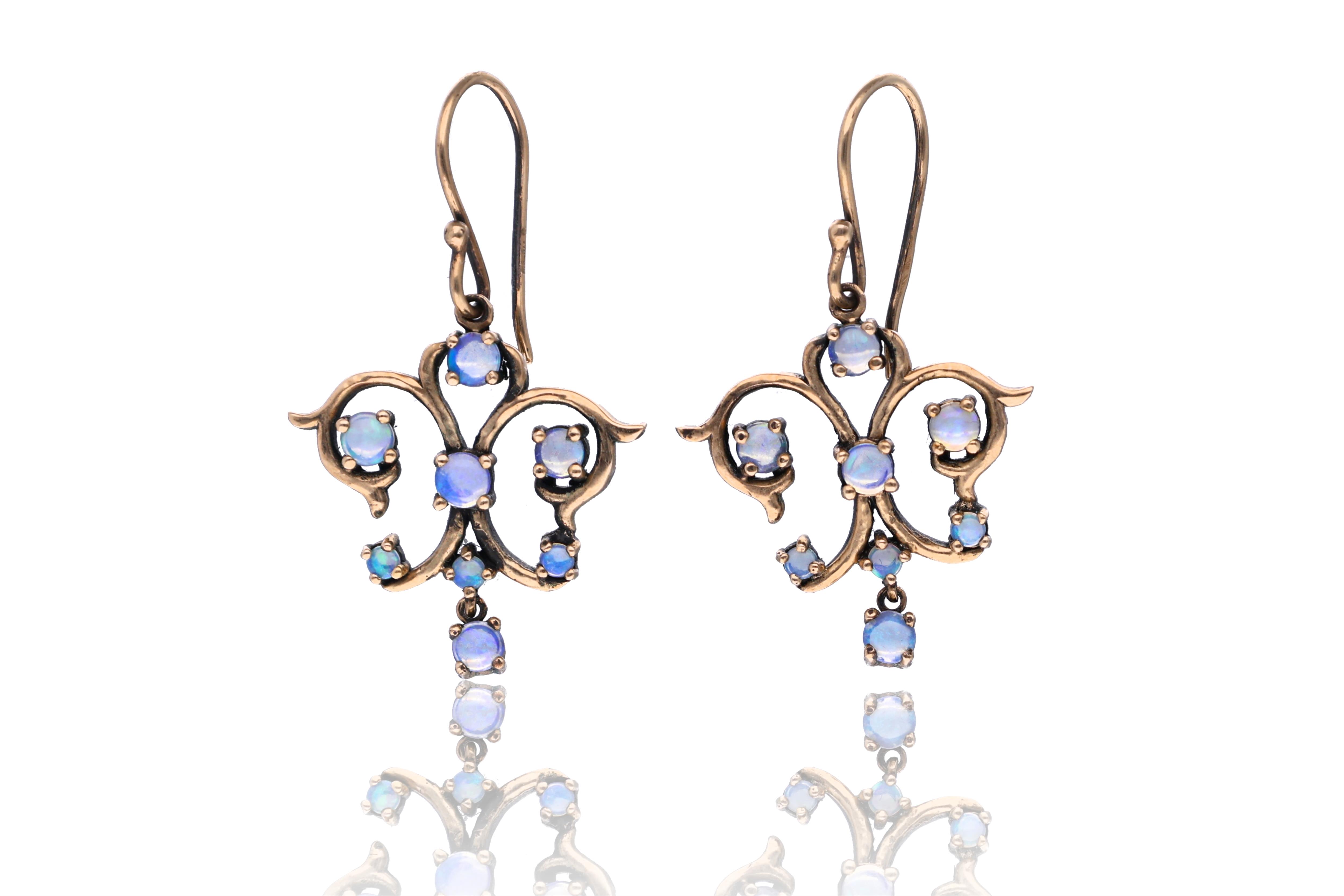 Paio di orecchini con opali - Asta Preziosi