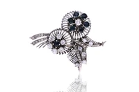 Spilla con diamanti e zaffiri - Asta Preziosi