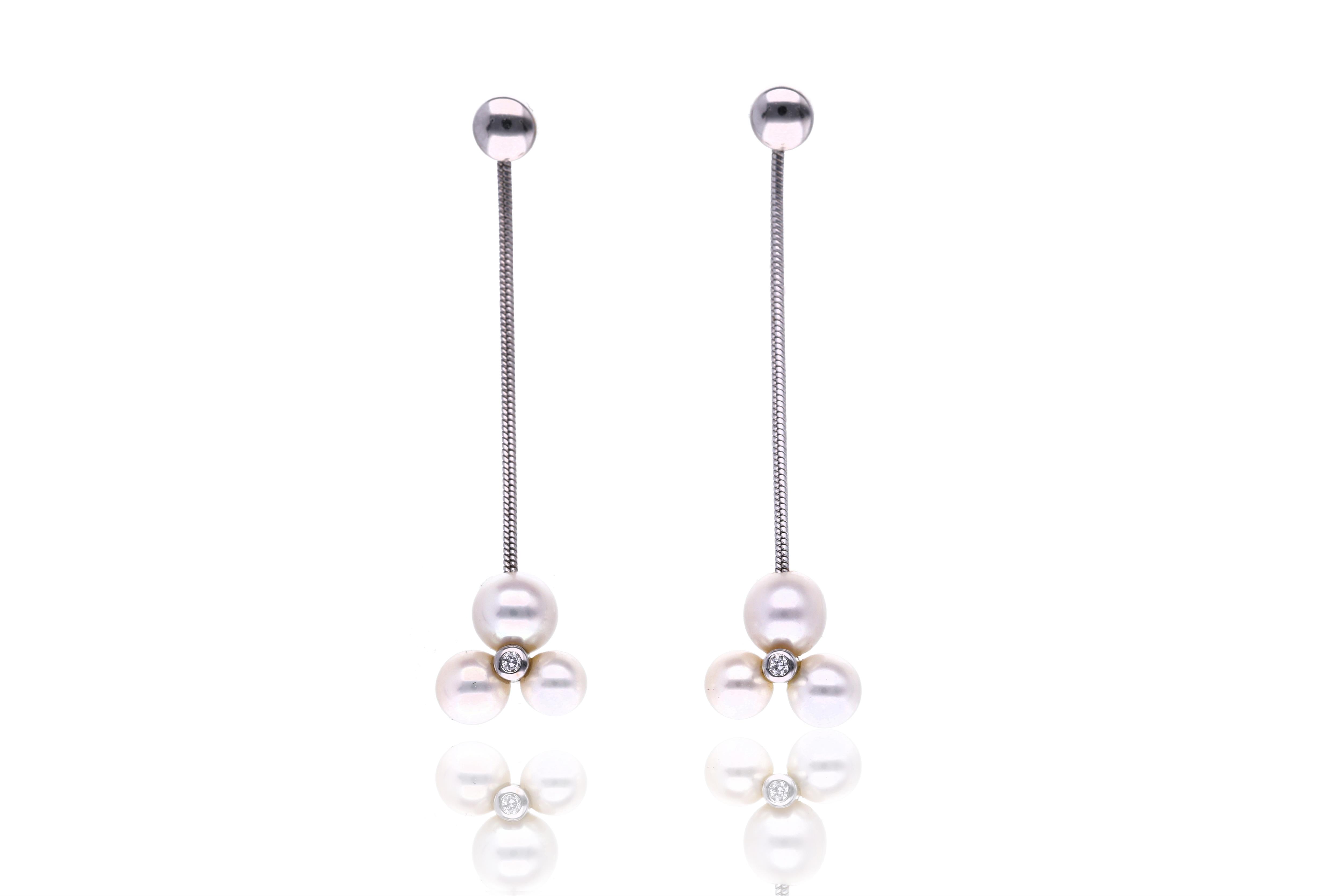 Paio di orecchini con diamanti e perle - Asta Preziosi