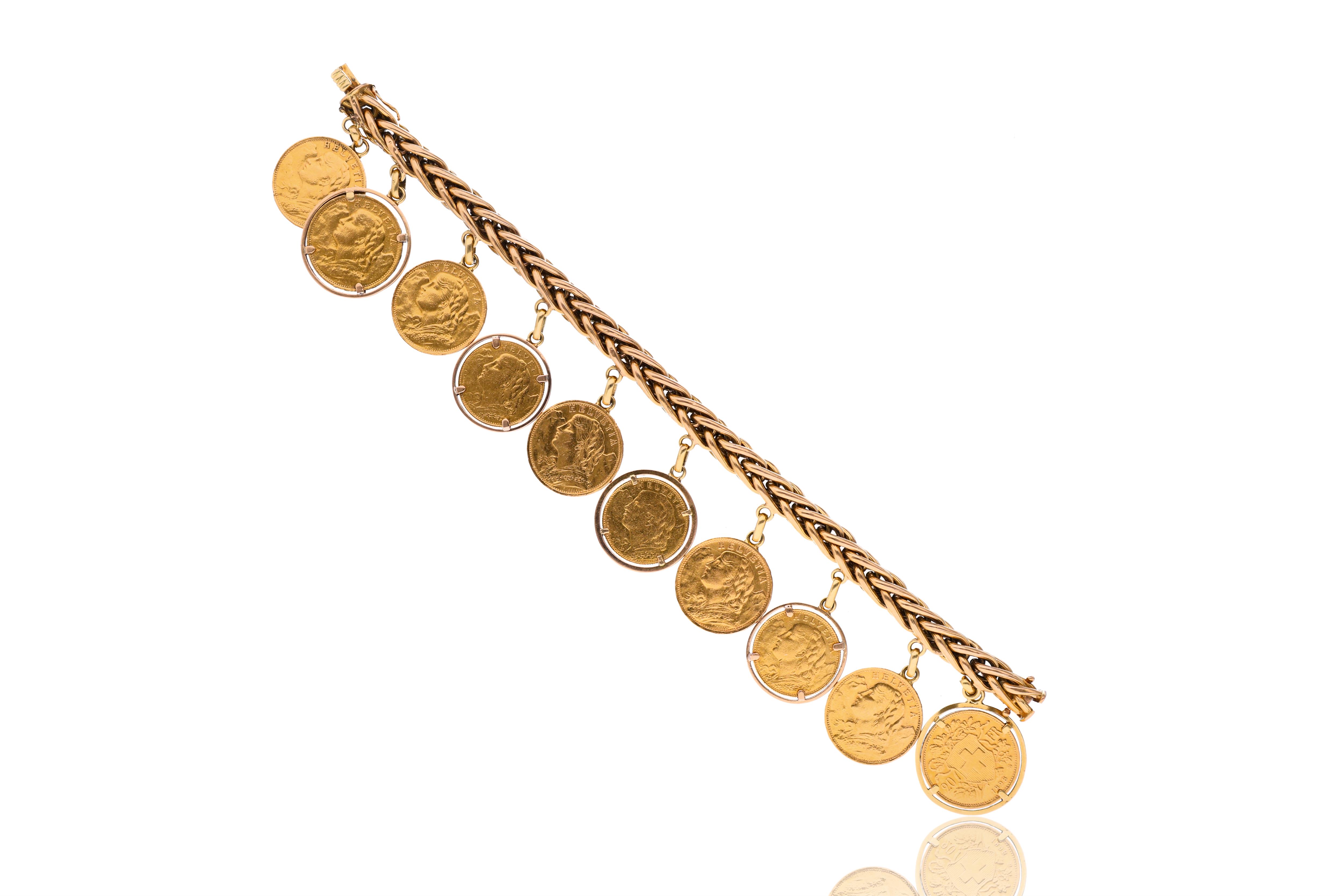 Bracciale con dieci ciondoli in oro - Asta Preziosi