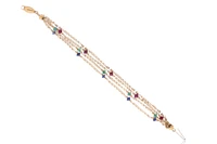 Bracciale con perle d'acqua dolce e rondelle di rubino, smeraldo e zaffiro - Asta Preziosi