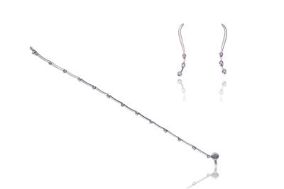 Bracciale 2 orecchini con diamanti - Asta Preziosi