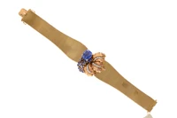Bracciale a fascia con zaffiri e diamanti - Asta Orologi & Gioielli Bracciale a fascia con zaffiri e diamanti - Asta Orologi & Gioielli