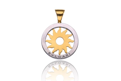 Bulgari, ciondolo sole in oro e acciaio - Asta Speciale