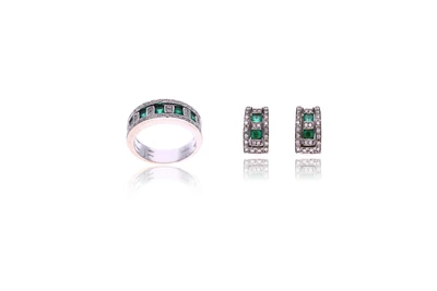 Damiani, anello e paio di orecchini con diamanti e smeraldi - Asta Speciale